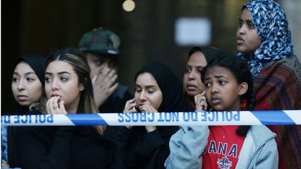 local residents watch as Grenfell Tower is engulfed by fire