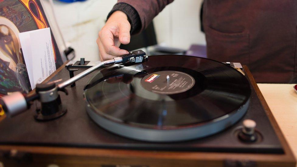 A vinyl record on a turntable