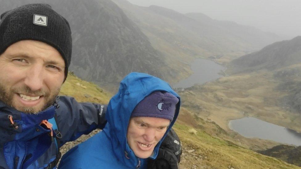 Mikey and brother Spencer on a walk up a mountain