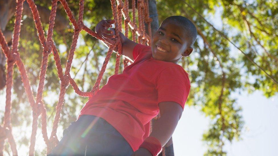 boy-climbing-rope-ladder