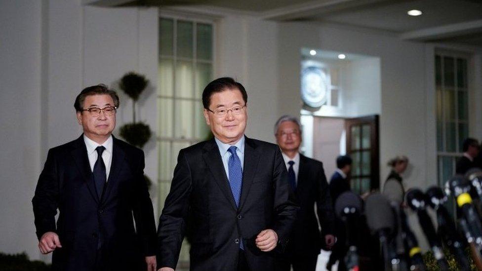 South Korean National Security Advisor Chung Eui-yong (C) and South Korea National Intelligence Service chief Suh Hoon (L) make their way to brief reporters outside the West Wing of the White House on March 8, 2018 in Washington, DC