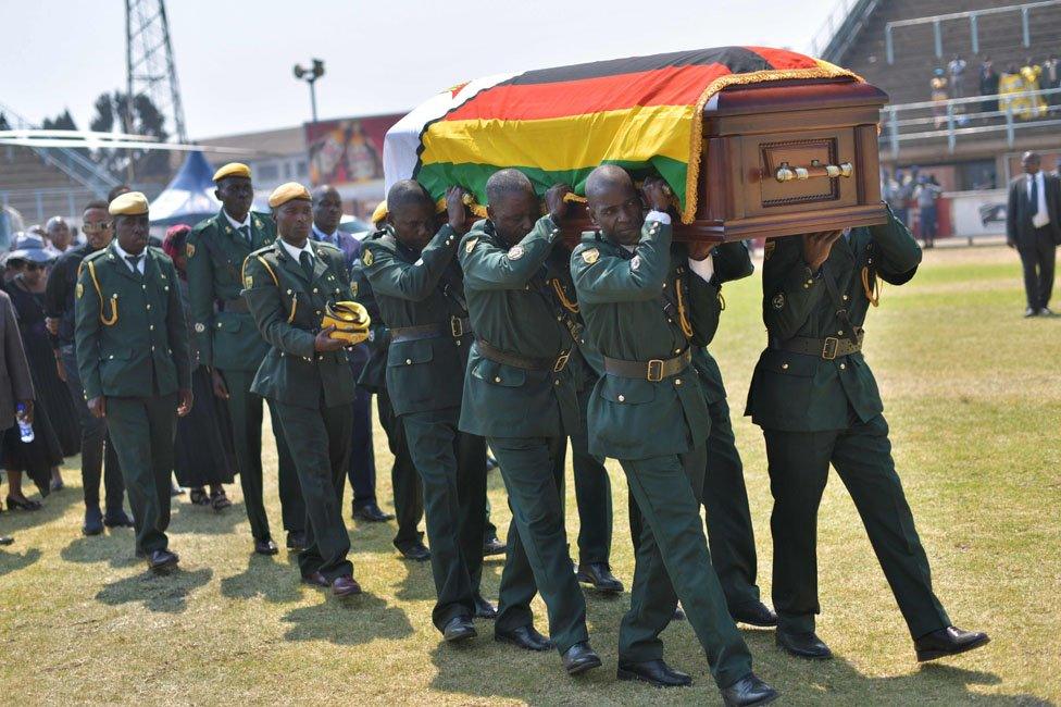 Soldiers carrying a coffin