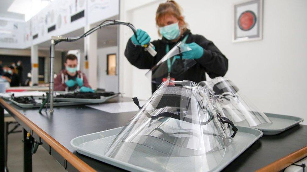 Woman making plastic face mask