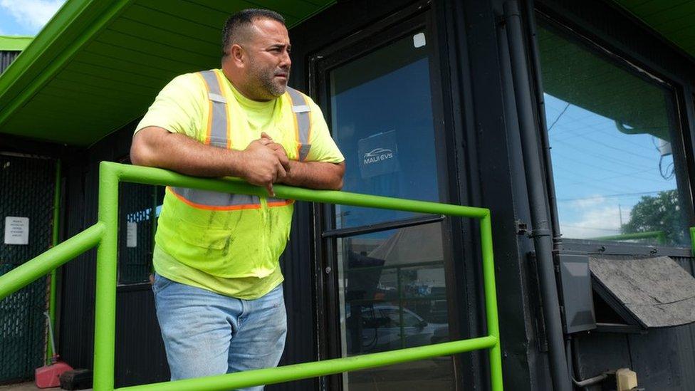 Eddie Iniba stands outside Shaka Detailing in Maui