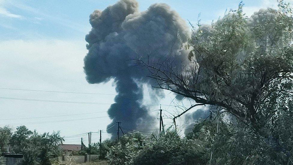 Smoke rises after explosions were heard from the direction of a Russian military airbase near Novofedorivka, Crimea August 9, 2022.