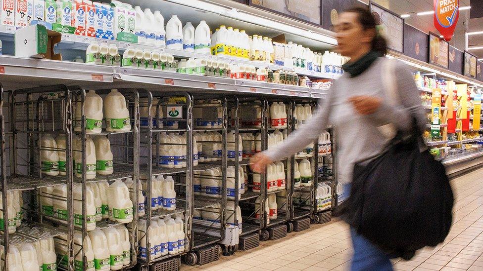 Woman walking in a supermarket