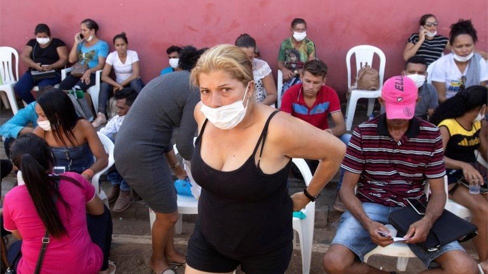 Relatives wait to enter the Legal Medical Institute to identify some of the bodies of the massacre which left 58 dead at the Altamira Regional Recovery Center, in Altamira, Brazil, 30 July 2019.