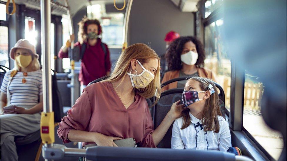 people-on-bus-wearing-facemask.