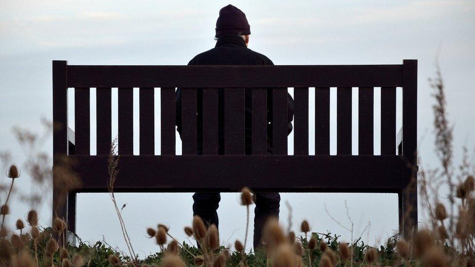 Old man sitting on bench