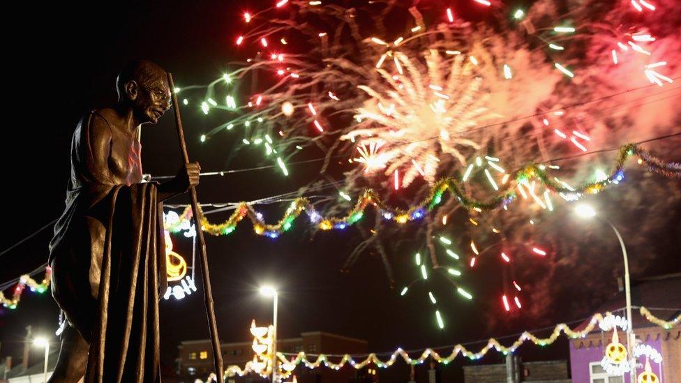 Fireworks explode near the Wheel of Light during Diwali celebrations in Leicester