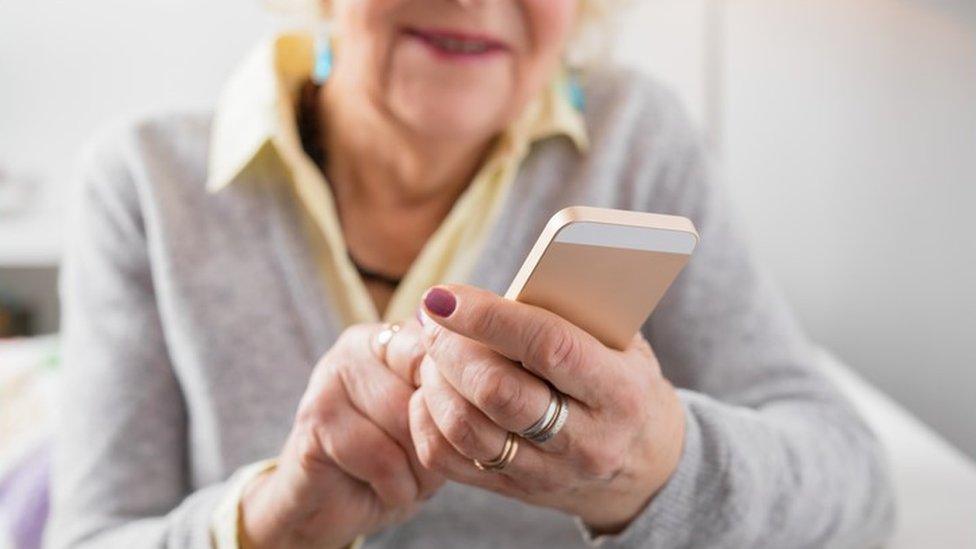 elderly woman using smartphone