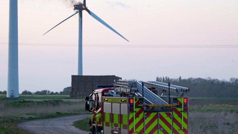 Wind turbine on fire and fire engine at Thorney, near Peterborough