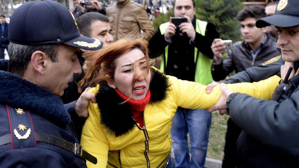 Police arrest a protester in Baku, 28 Feb 15