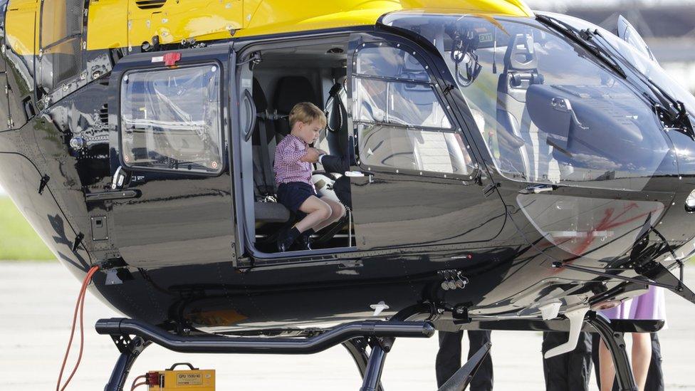 George sitting in a helicopter