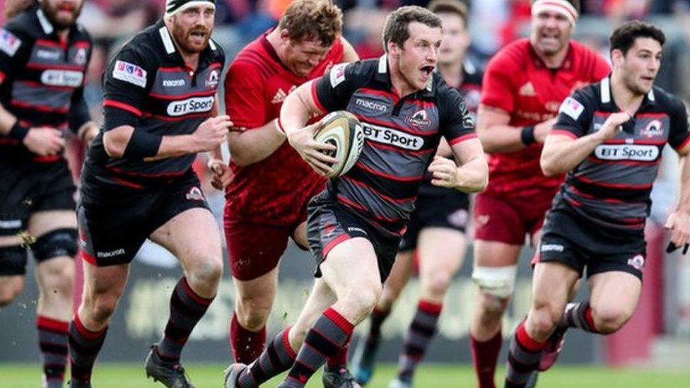 Mark Bennett makes a break for Edinburgh against Munster