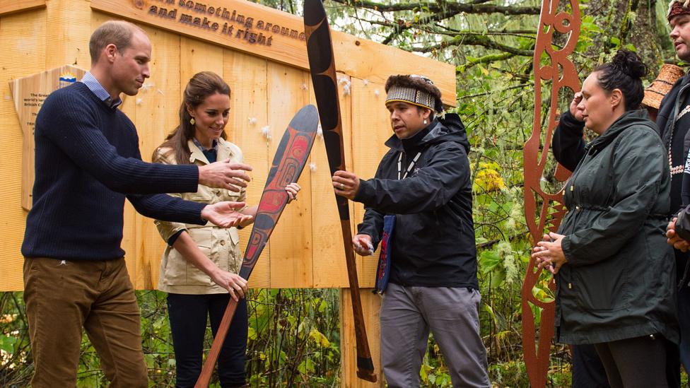 The Duke and Duchess of Cambridge are presented with canoe paddles as a gift from the Heiltsuk First Nation community during a visit to the Great Bear Rainforest in Bella Bella, Canada, during the third day of the Royal Tour to Canada