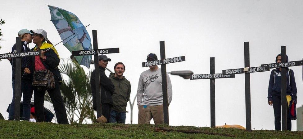 Protesters install crosses with the names of some of the victims left by more than a month of protests during the "Gran Planton Nacional" (Big National Stand) summoned by the opposition in Caracas, Venezuela, 15 May 2017