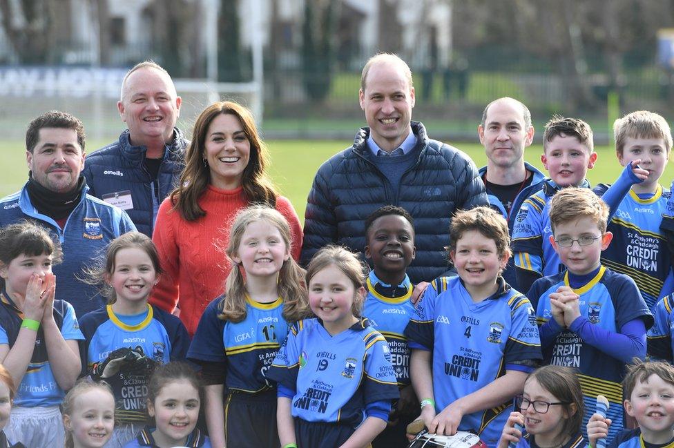 William and Kate pose with children during a visit to Salthill Knocknacarra GAA club