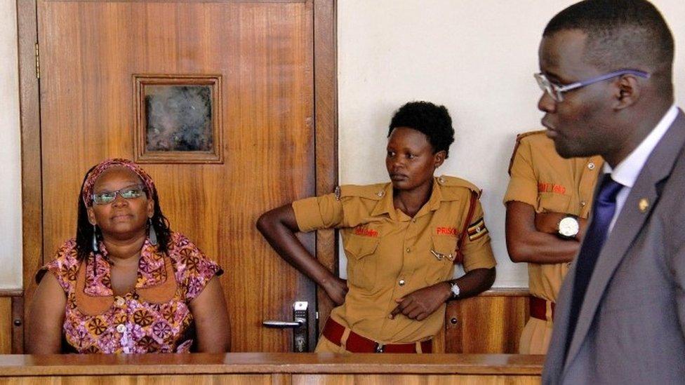 University lecturer and activist Doctor Stella Nyanzi (L) reacts in court as she attends a trial to face charges for cyber-harassment and offensives communication, in Kampala