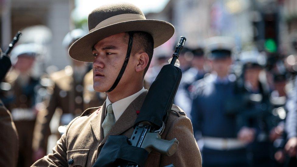 Military personnel take part in a dress rehearsal