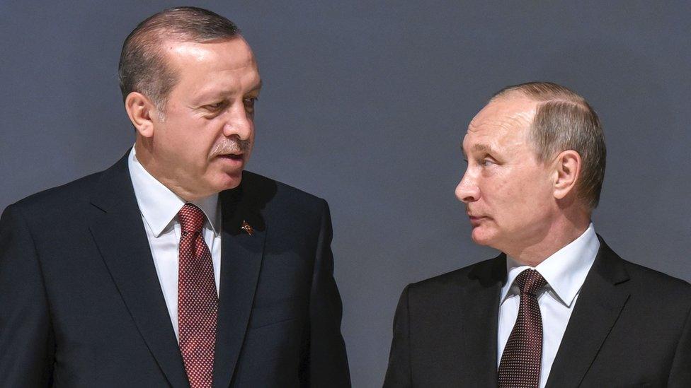 This file photo taken on October 10, 2016 shows Russian President Vladimir Putin (R) listening to Turkish President Recep Tayyip Erdogan