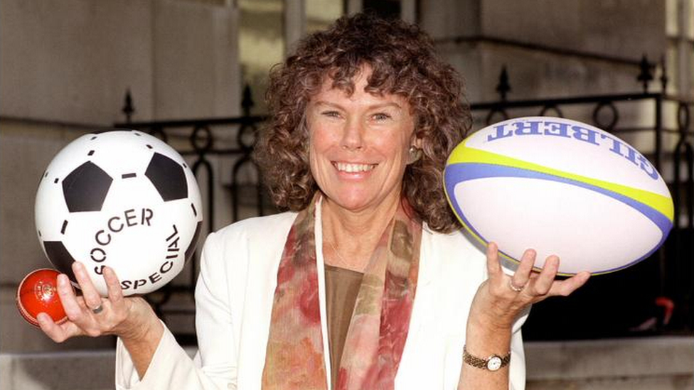 Kate Hoey pictured as Minister for Sport in July 1999 holding a cricket ball and football in her right hand and a rugby ball in her left