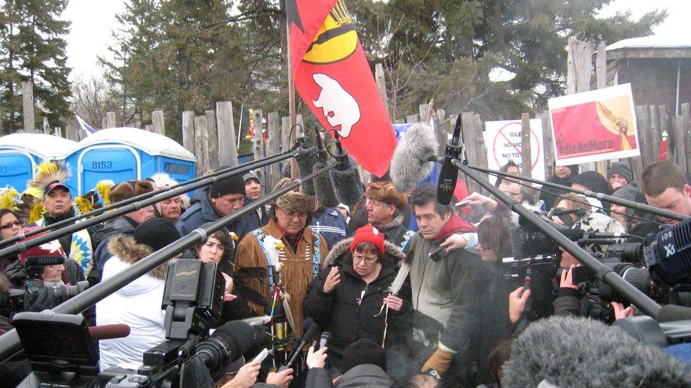 Attawapiskat Chief Theresa Spence (C) holds a press conference on January 11, 2013 at her camp on Victoria island in view of Canada's parliament in Ottawa, Ontario announcing her hunger strike for improved living standards on reserves will continue as long as the prime minister and governor general refuse to meet jointly with her to discuss natives' plight.