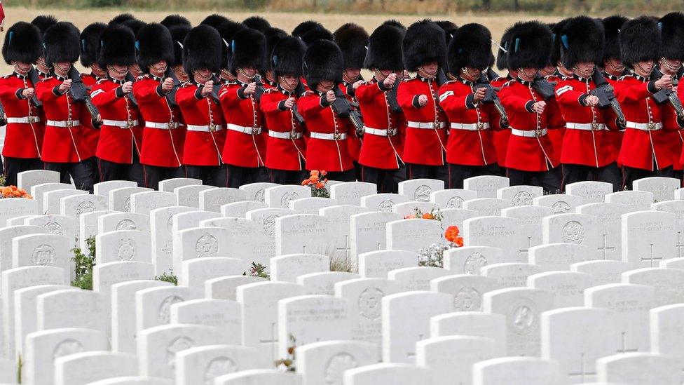 Members of the Irish Guard marching in the Tyne Cot cemetery