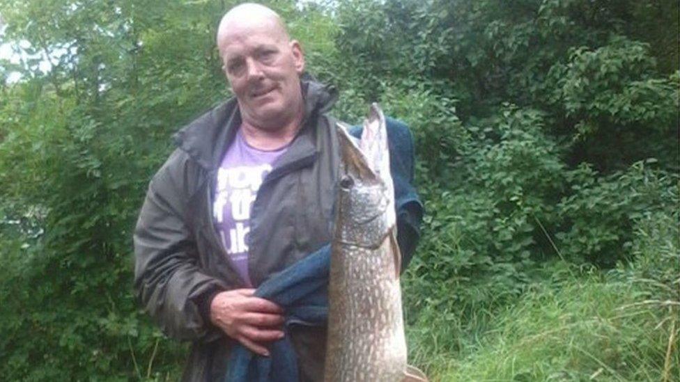 Scott Wilkinson holding a fish