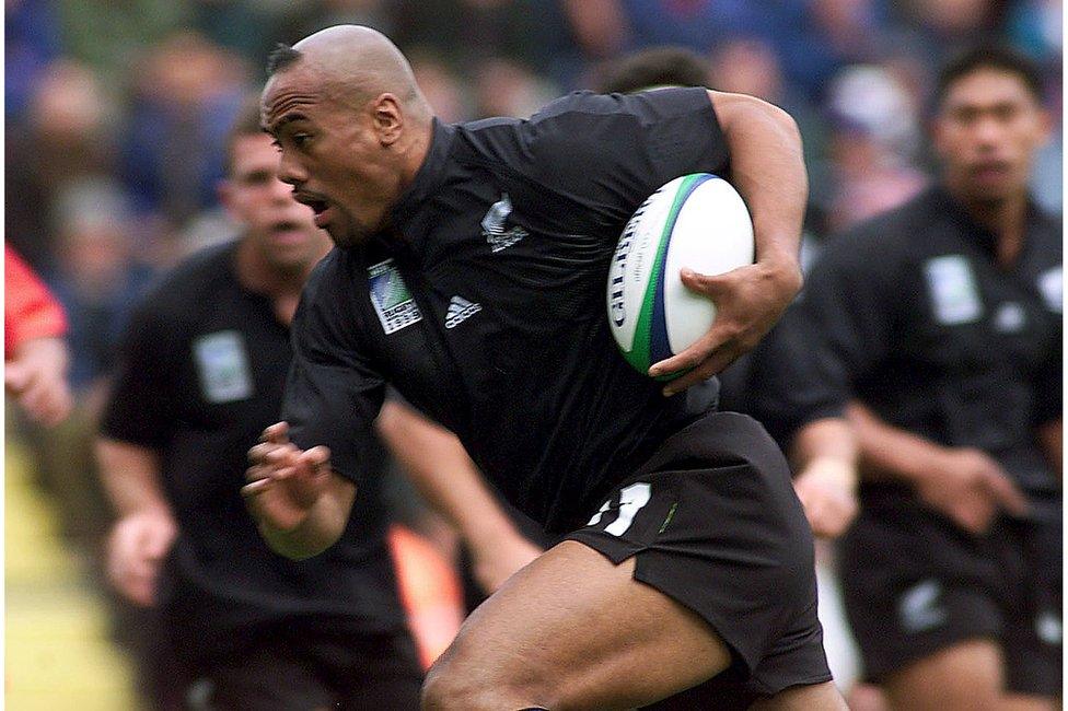 File picture of New Zealand's Jonah Lomu as he tucks the ball under his arm to run and score the All Blacks' first try against Tonga during their Rugby World Cup Group B match at Ashton Gate in Bristol, England, in this 3 October 1999 file photo