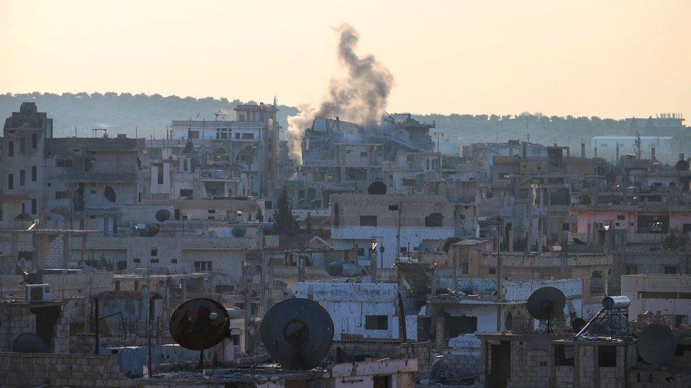 Smoke billows from building in rebel-held area of Deraa after reported shelling by Syrian government forces (22 January 2017)