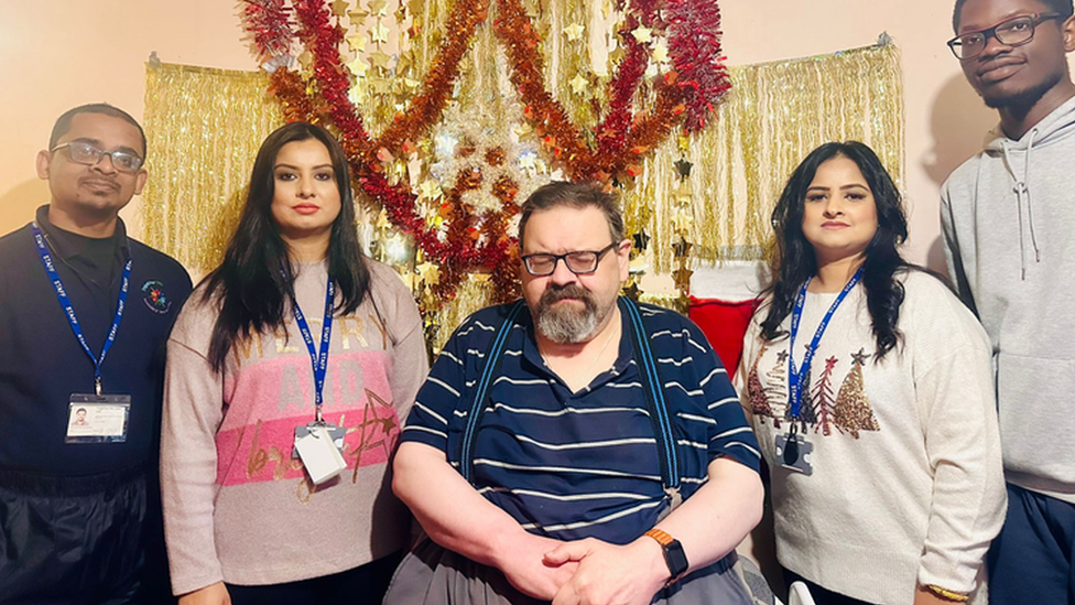 Stephen pictured with his regular carers and directors Kiran and Nargis Mahmood