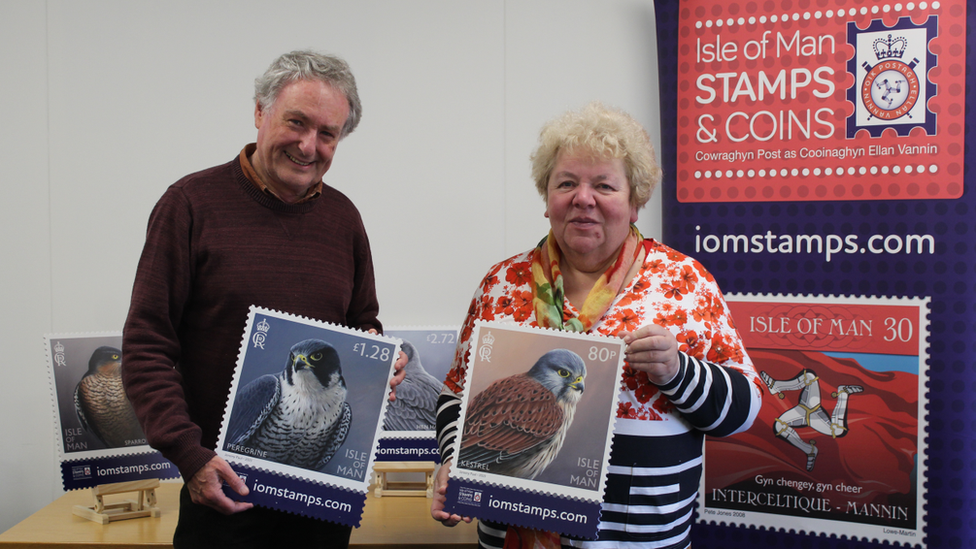 Jeremy Paul and Maxine Cannon with copies of the stamps