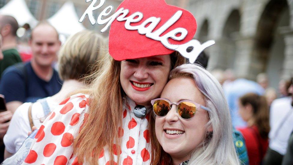 People celebrate the result of Friday's referendum on liberalising abortion law, in Dublin, Ireland.