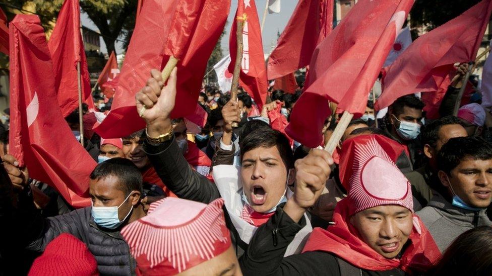 Nepalese Communist activists take a part in a rally against the dissolution of parliament in Kathmandu, Nepal