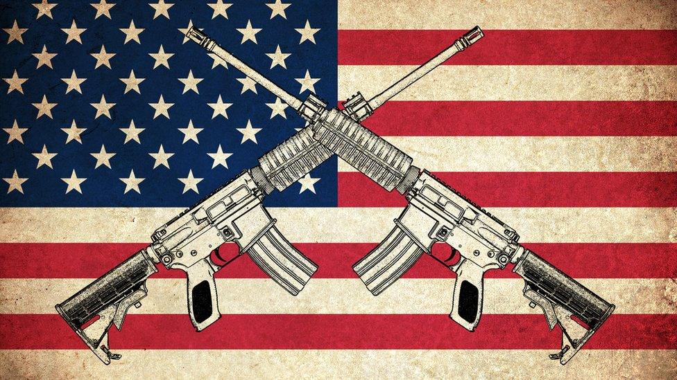 Guns on top of an American flag