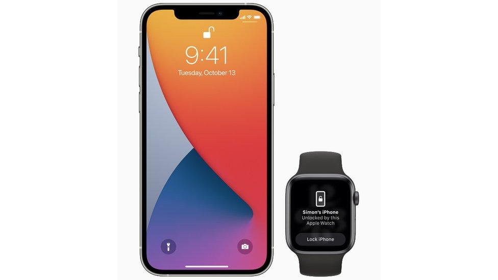 An iPhone next to an Apple Watch