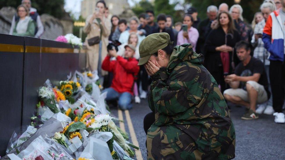 Members of the public leave flowers outside Windsor Castle