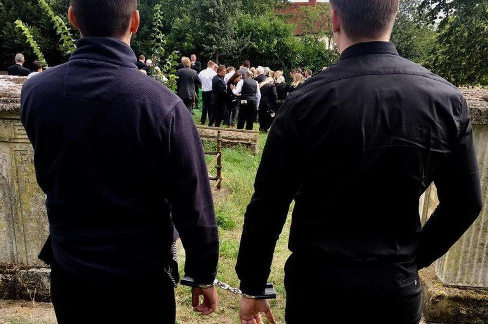 Elliot Murawski in handcuffs at his grandfather's funeral