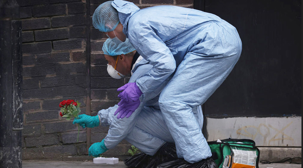 Forensic investigators at the scene of the stabbing