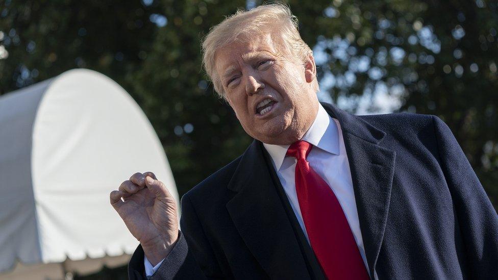 US President Donald J. Trump speaks to the media as he departs the White House on his way to Camp David, in Washington, DC