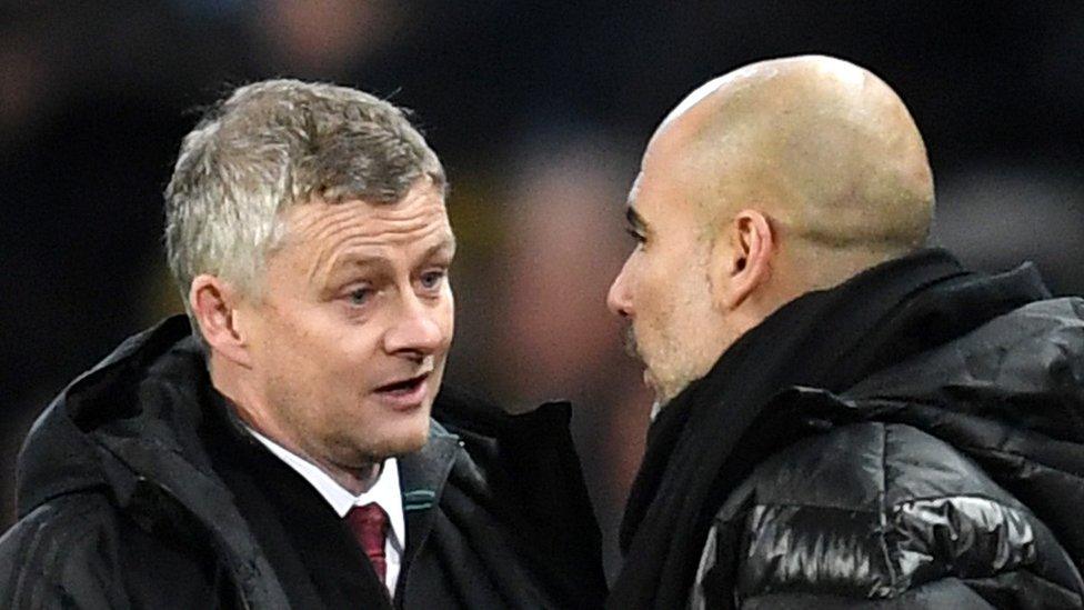 Ole Gunnar Solskjaer and Pep Guardiola chat