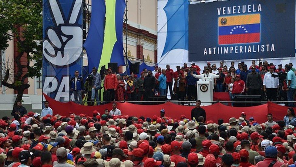 Venezuela's President Nicolas Maduro gestures during a rally at the Miraflores Presidential Palace in Caracas, Venezuela