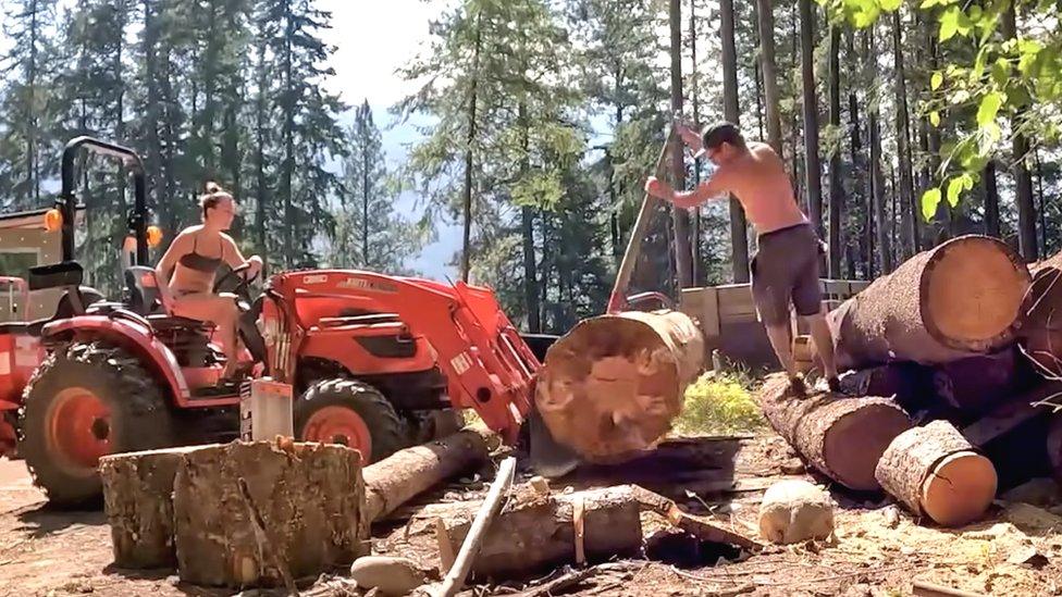 Katie Erickson and Greg Mooney working at their off-grid home