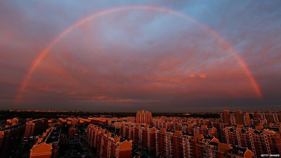A rainbow appears over Beijing, China on August 3, 2015.