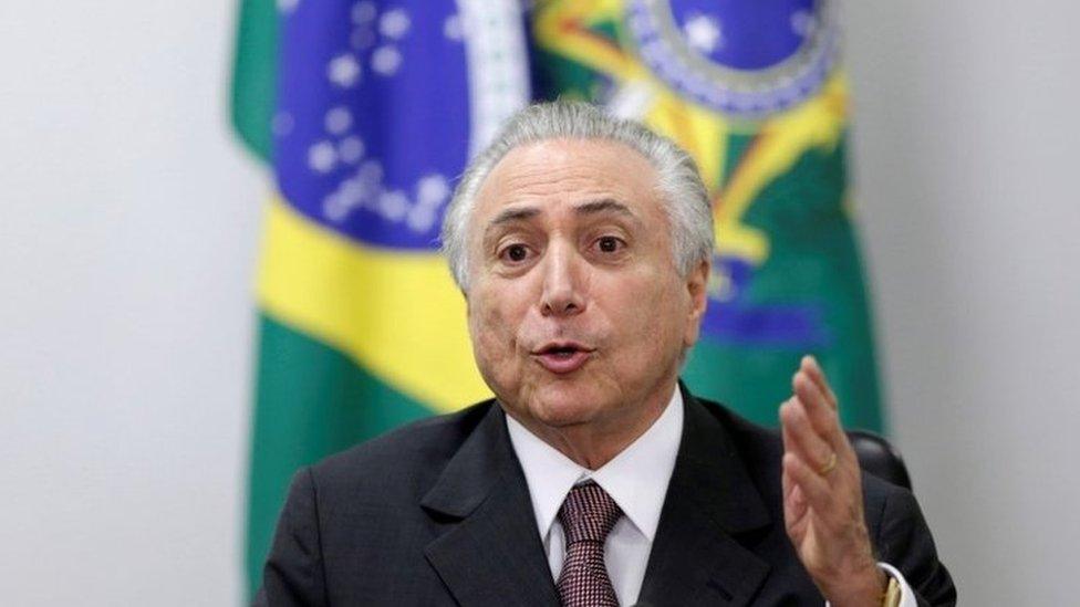 Brazil's interim President Michel Temer gestures during a meeting with defence officials regarding the security of the 2016 Rio Olympics, at the Planalto Palace in Brasilia, Brazil, May 16, 2016.