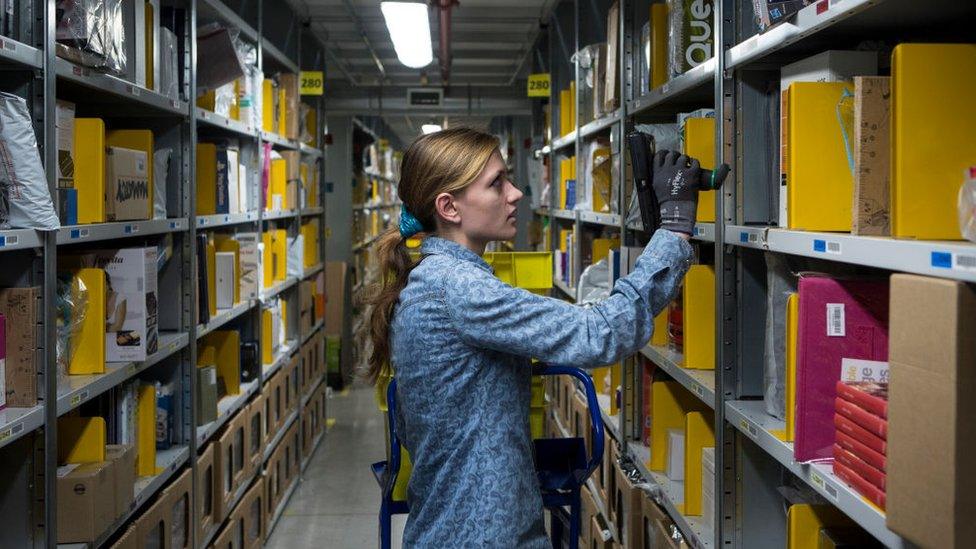 woman in Amazon warehouse