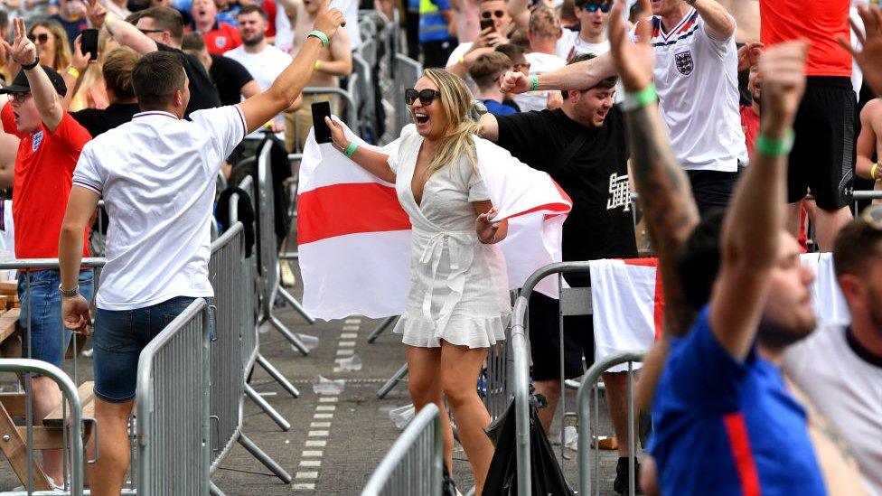 Fans celebrate as England score their first goal at the 4TheFans fan zone in Manchester