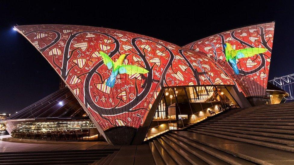 An Indigenous light display projected on to the Sydney Opera House