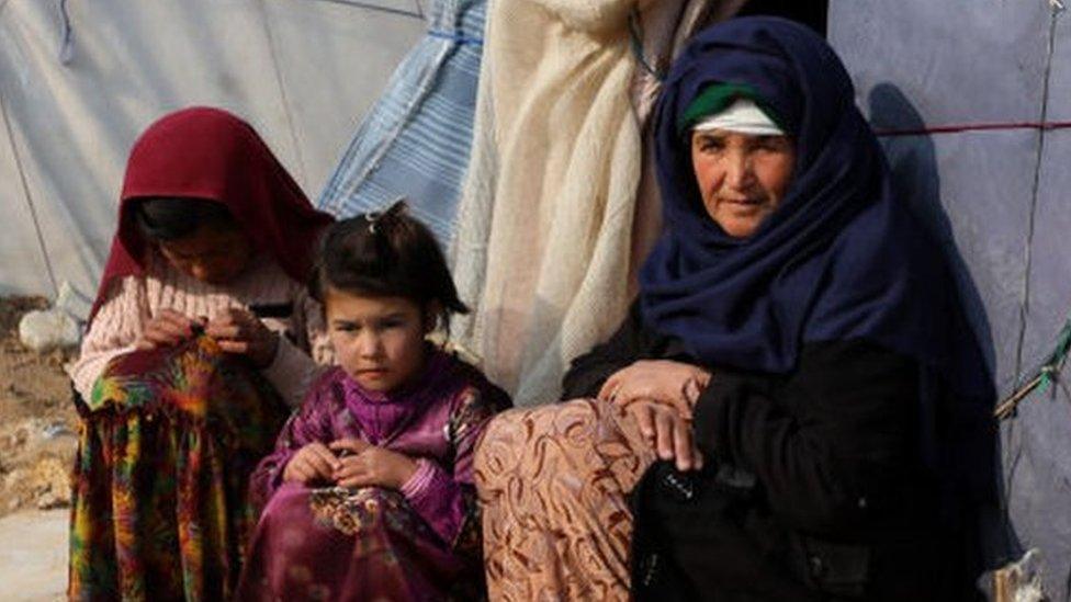 Internally displaced Afghans are seen in a camp in Balkh, Afghanistan